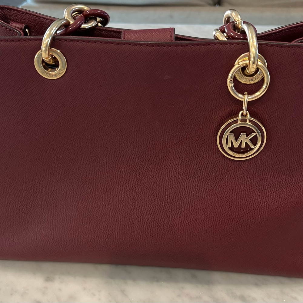Genuine Michael Kors Maroon Bag. Great condition. Barely used.